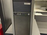 the computer is sitting on top of the stand in the room