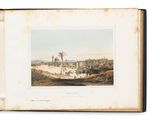 un vieux livre sur lequel figure l'illustration d'un paysage désertique
