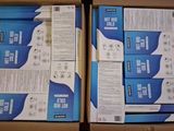 two boxes of blue and white electronic equipment sitting on top of a table
