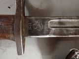 a close up of a knife on a table