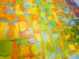 peinture abstraite représentant un motif de carrés jaunes, verts, bleus et rouges