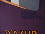 a purple book with a picture of a man in a suit and tie