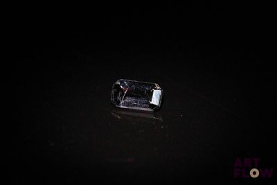 a cell phone that is in the water at night