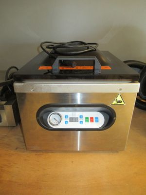 a machine that is sitting on a wooden table
