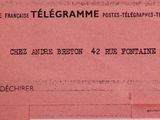 a pink ticket with a picture of a telephone on it