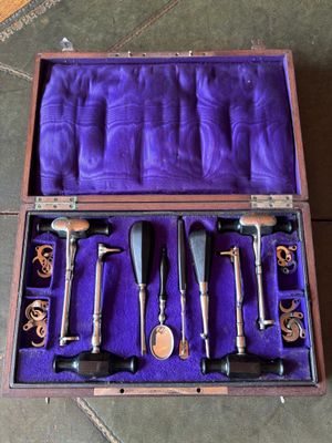 a purple case with a set of tools in it