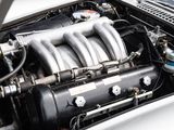 a close up of the engine of a car with its hood open