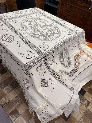 a table with a white table cloth on top of it