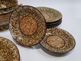 many plates and bowls that are sitting on a table