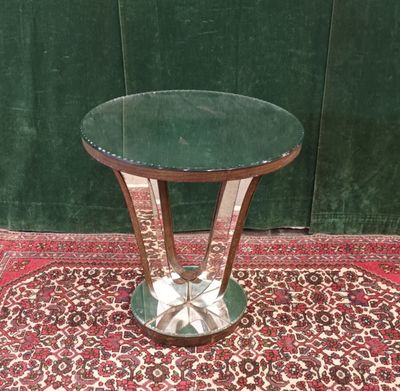 a small table with a glass top on a rug