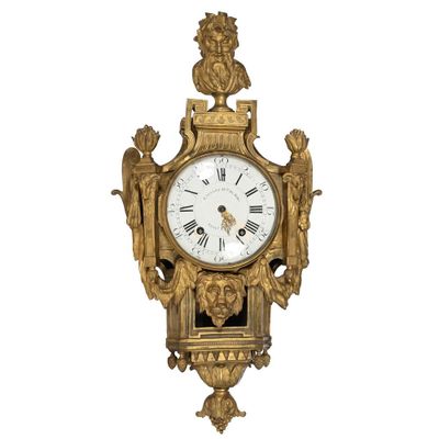 a gold clock on a white background with a white background