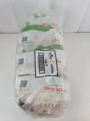 several bags of food sitting on top of a white counter