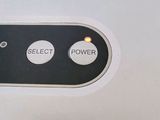 a close up of a button on the back of a cell phone