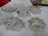 a lot of glass dishes and bowls on a table
