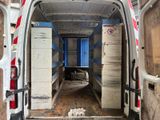 a white van with a blue door in the back of it