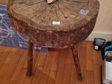 a wooden table with a mirror on top of it