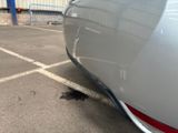 a close up of a car parked in a parking lot