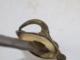 a metal spoon with a handle that has a handle on it