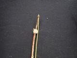a stick with a white ball on it and a stick with a white ball on it