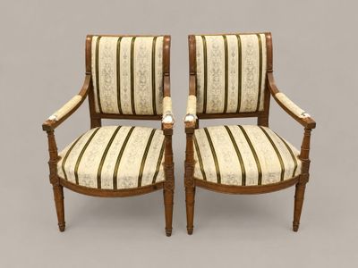 pair of antique chairs with striped upholstered arms and arms