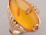an image of a ring with a yellow stone in it