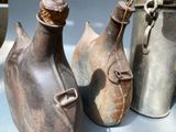 three vases that are sitting on a table
