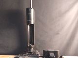 an image of a camera and a microscope on a table
