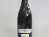 a bottle of wine that is sitting on a table
