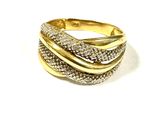 a close up of a gold and diamond ring on a white background