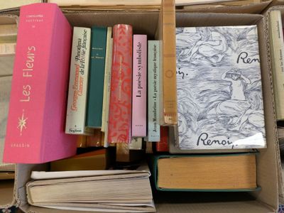 a box full of books that are sitting on the floor