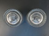 two glasses that are sitting on a table