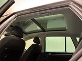 a view of the inside of a car with the sunroof