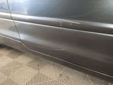 a close up of a car ' s side door with a hole in it