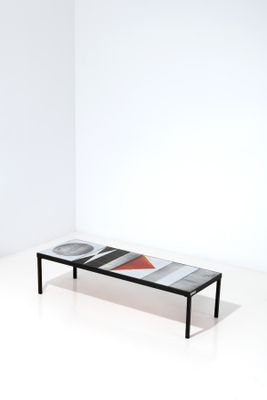 a black and white bench with a red and white design on it
