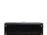 a black leather case sitting on top of a white surface