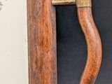a close up of a door handle on a wooden door