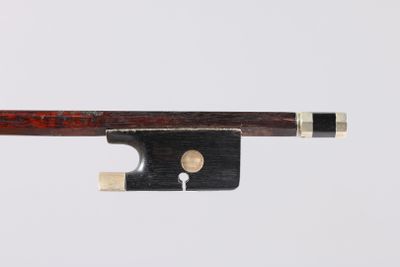 a close up of a violin bow on a white background