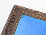 a picture of a picture of a mirror with a blue background