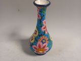 a small blue vase with a floral design on it
