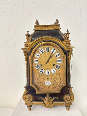 a clock that is sitting on top of a table