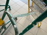 an image of a shopping cart on the floor of a subway station
