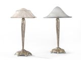 a pair of silver and white lamps on a white background