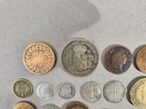 a lot of coins that are on the table