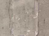 a piece of paper with writing on it sitting on the sidewalk