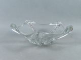 clear glass bowl on a white table with a white background