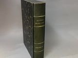 an old book sitting on top of a table next to a white background