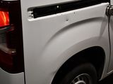 an image of a white truck parked in a parking lot