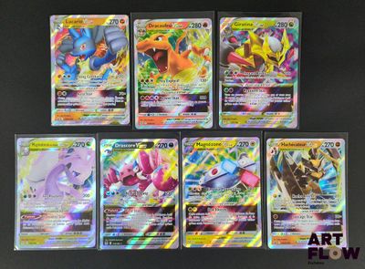 Des cartes Pokémon sont alignées en rangée sur une table