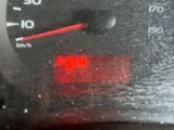 a close up of a speedometer on a car ' s dashboard