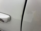 a close up of a car door handle with a sticker on it